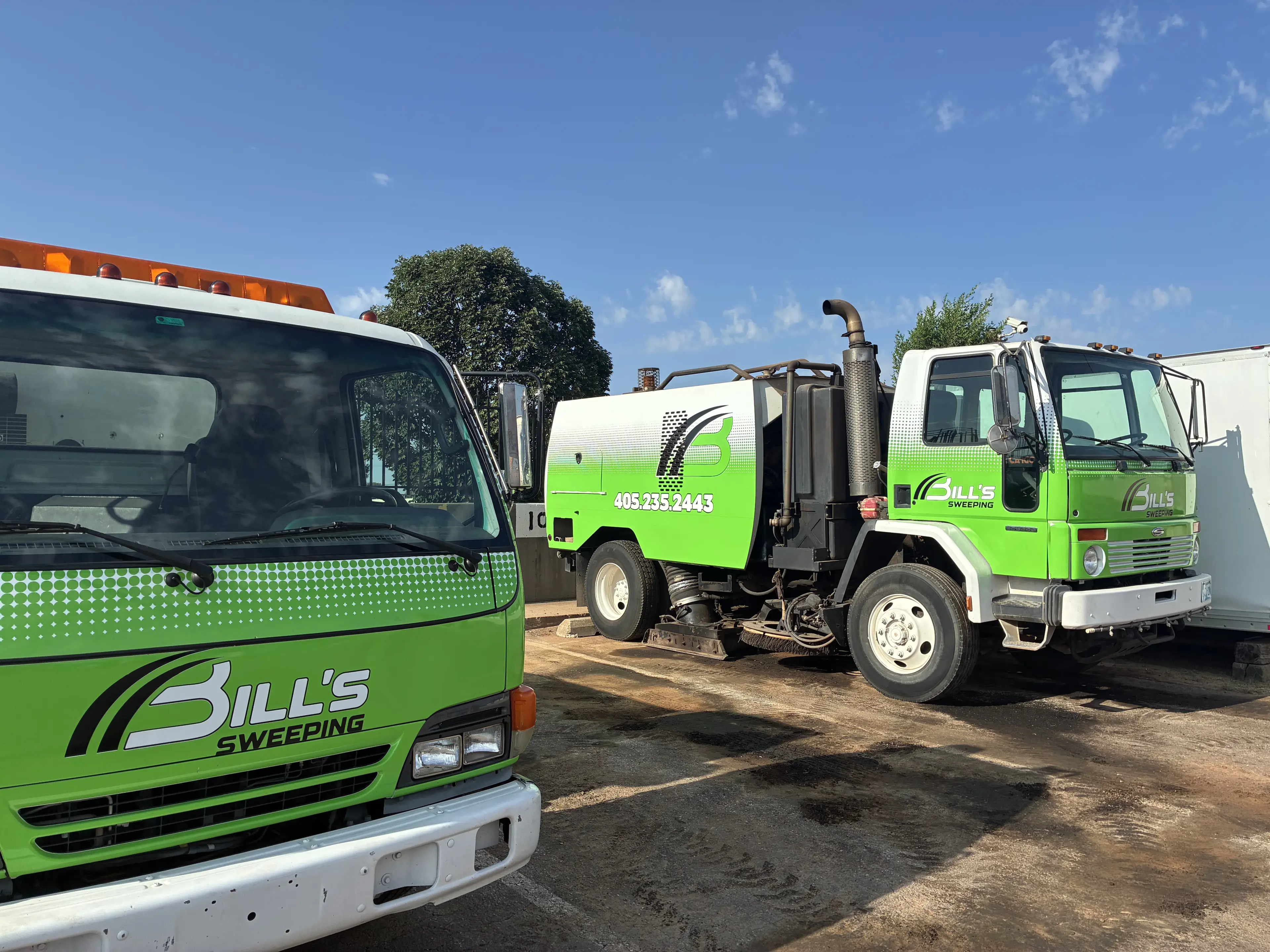 Bill's Pavement sweeping equipment cleaning a paved property